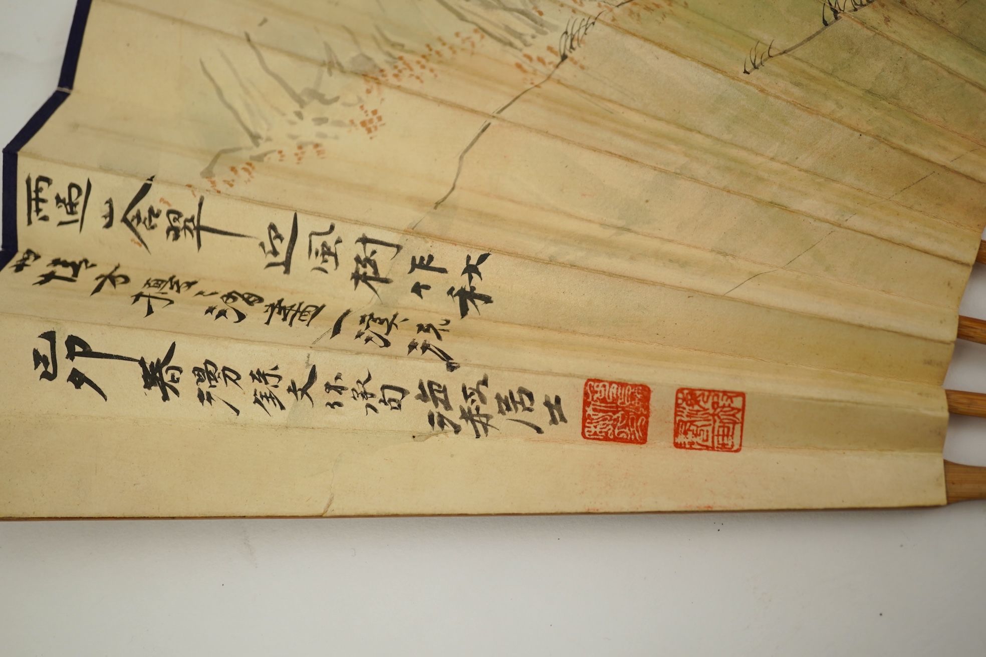 Two Chinese inscribed paper leaf fans, late 19th century